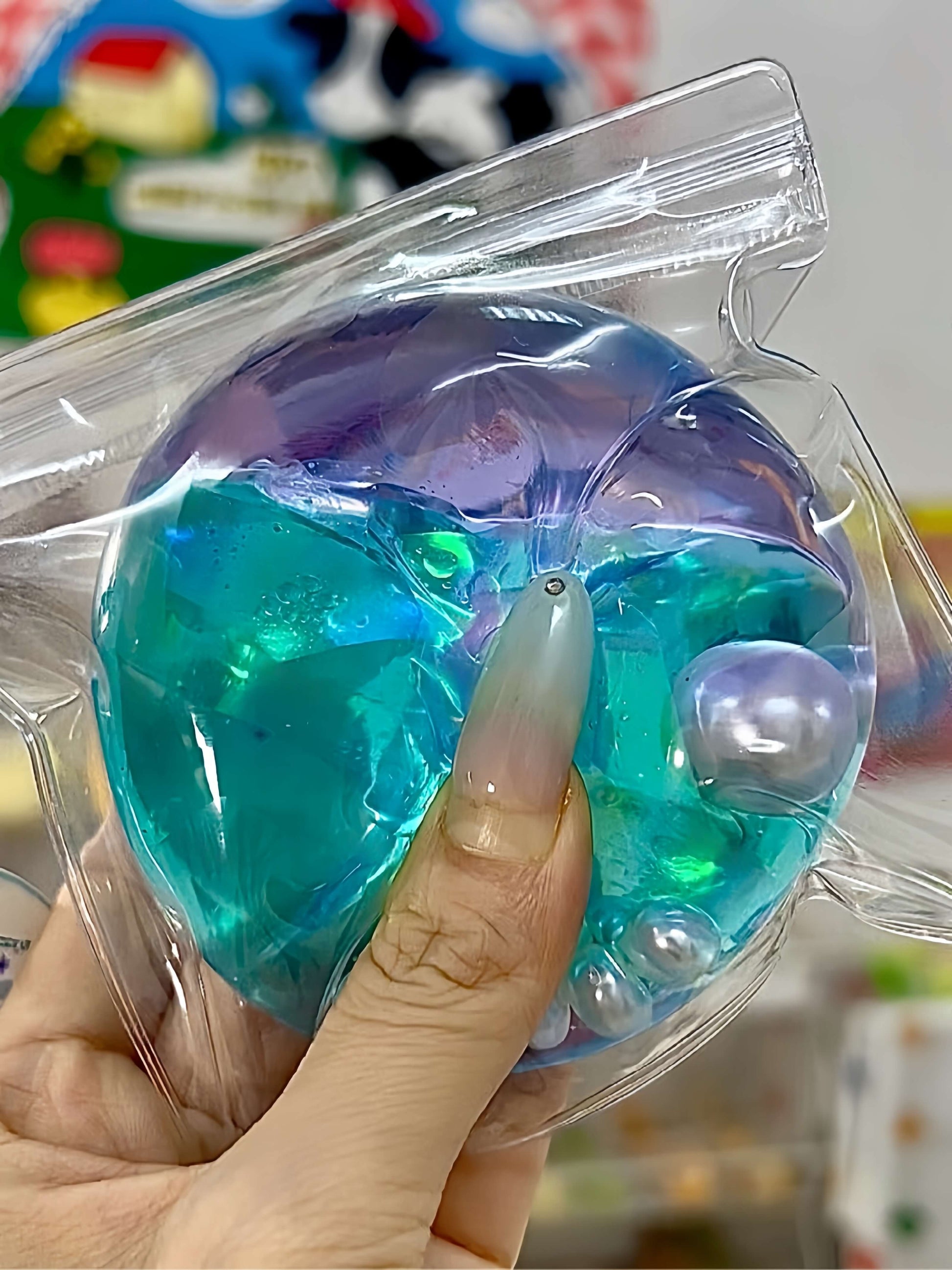 Non-toxic handmade layered dual-color stress relief ball with Aurora nebula colors, flowing sand texture