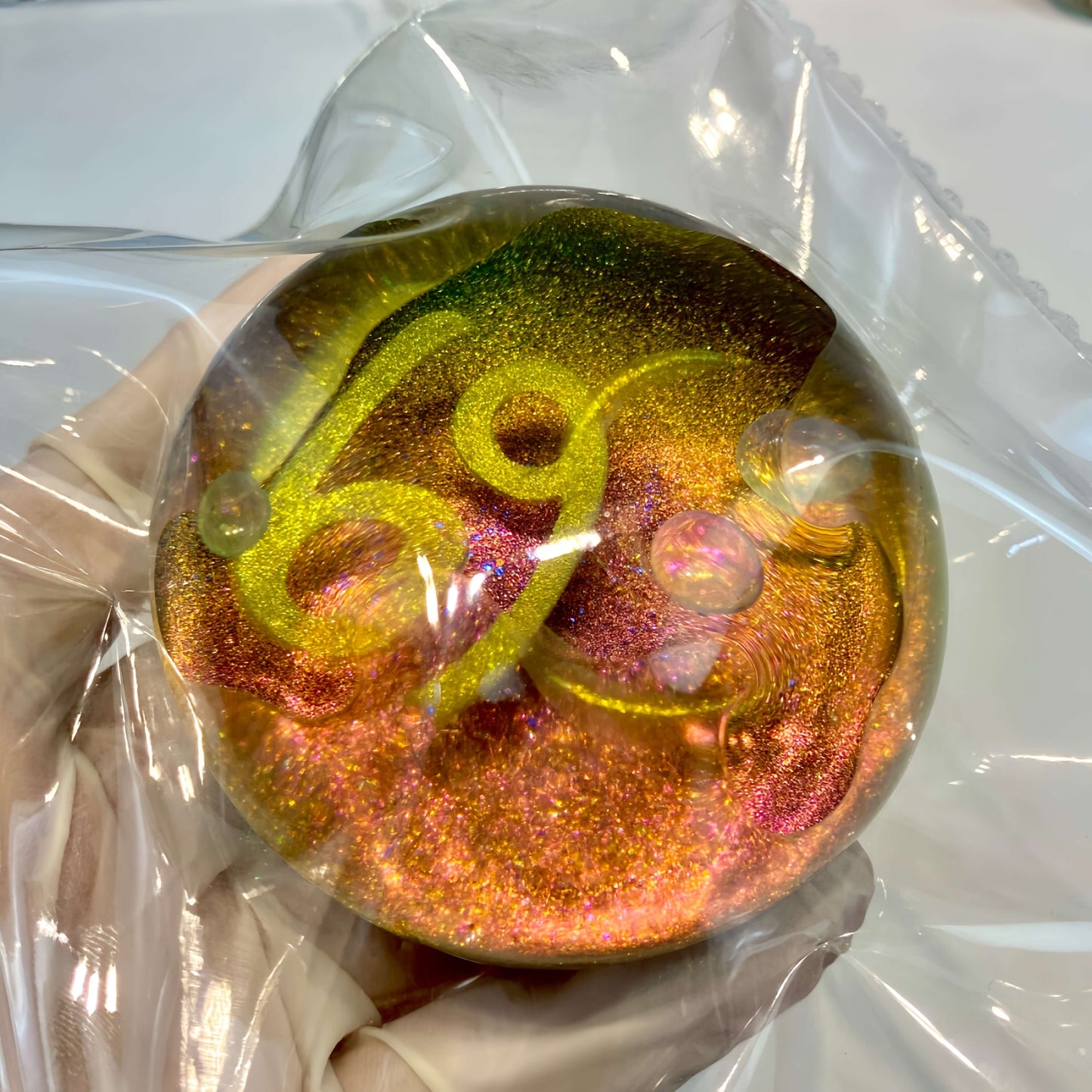 Clear silicone Cancer galaxy orb with neon nebula design from lovesquishy