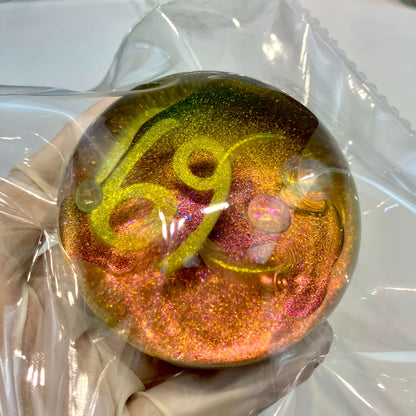 Clear silicone Cancer galaxy orb with neon nebula design from lovesquishy