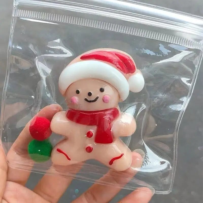 Gingerbread man squishy with Santa hat, red scarf, packaged in clear plastic – lovesquishy holiday collection