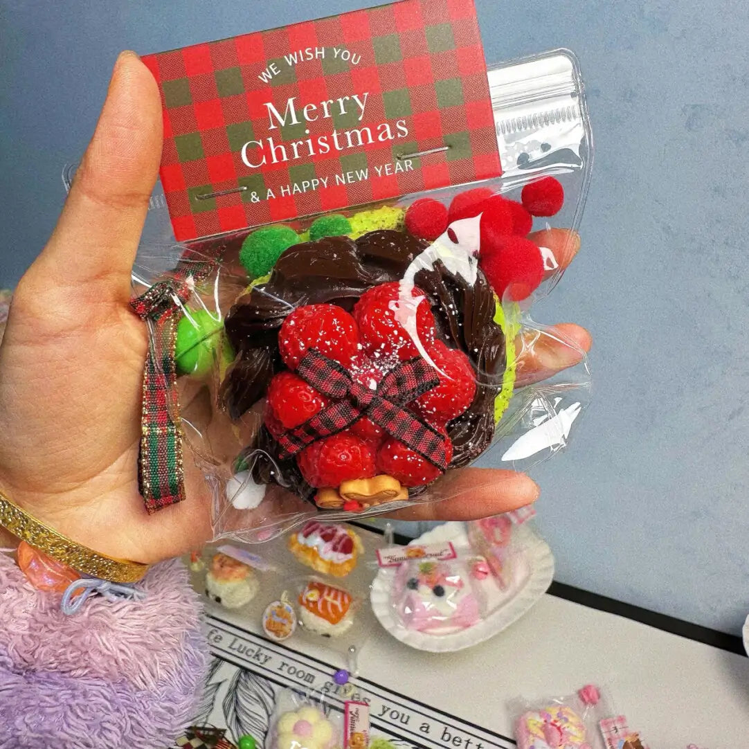 Christmas raspberry cake squishy with strawberries, chocolate, packaged in clear plastic – lovesquishy holiday collection