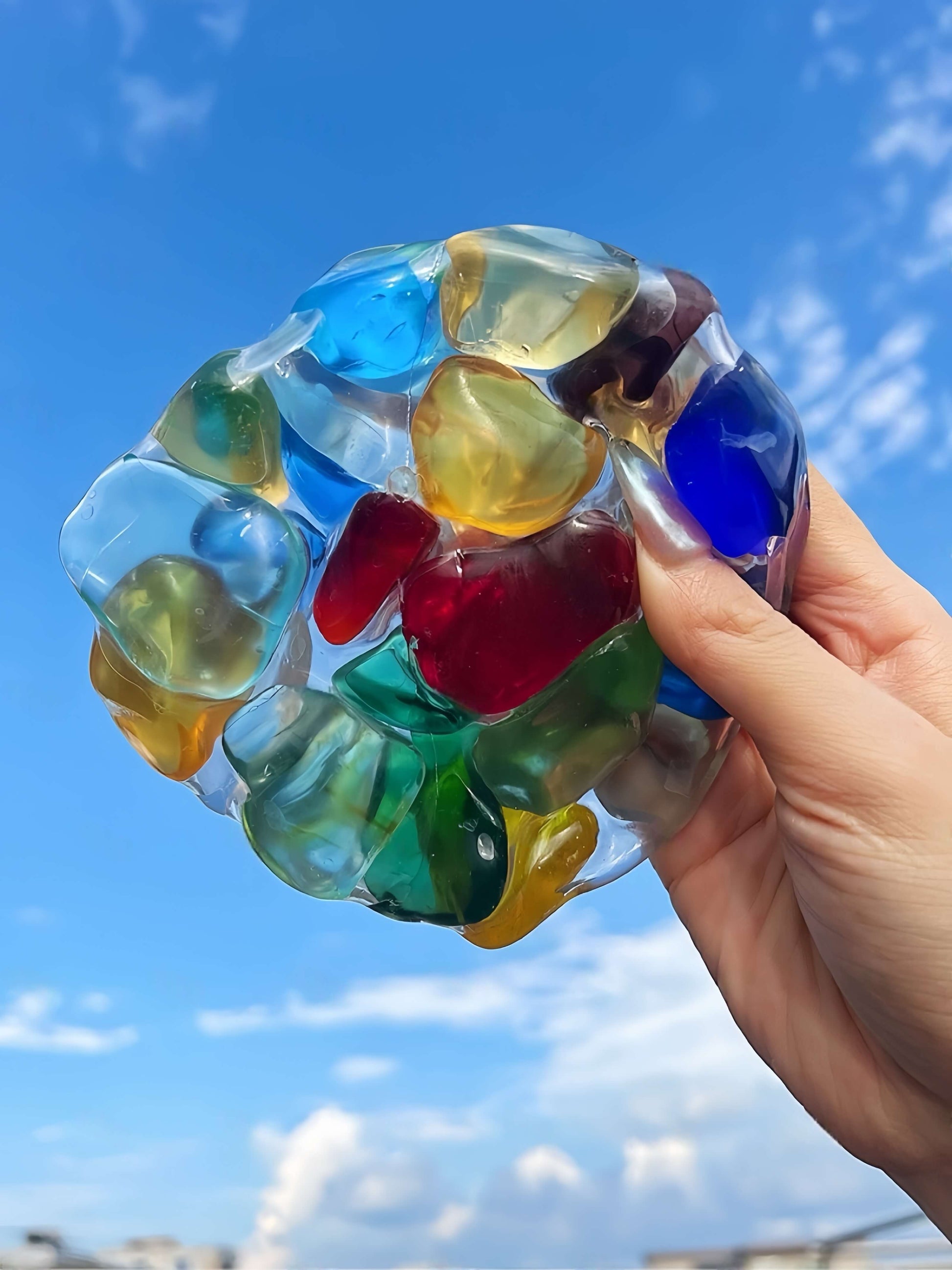 Handheld multicolor squishy ball at lovesquishy, stress relief toy