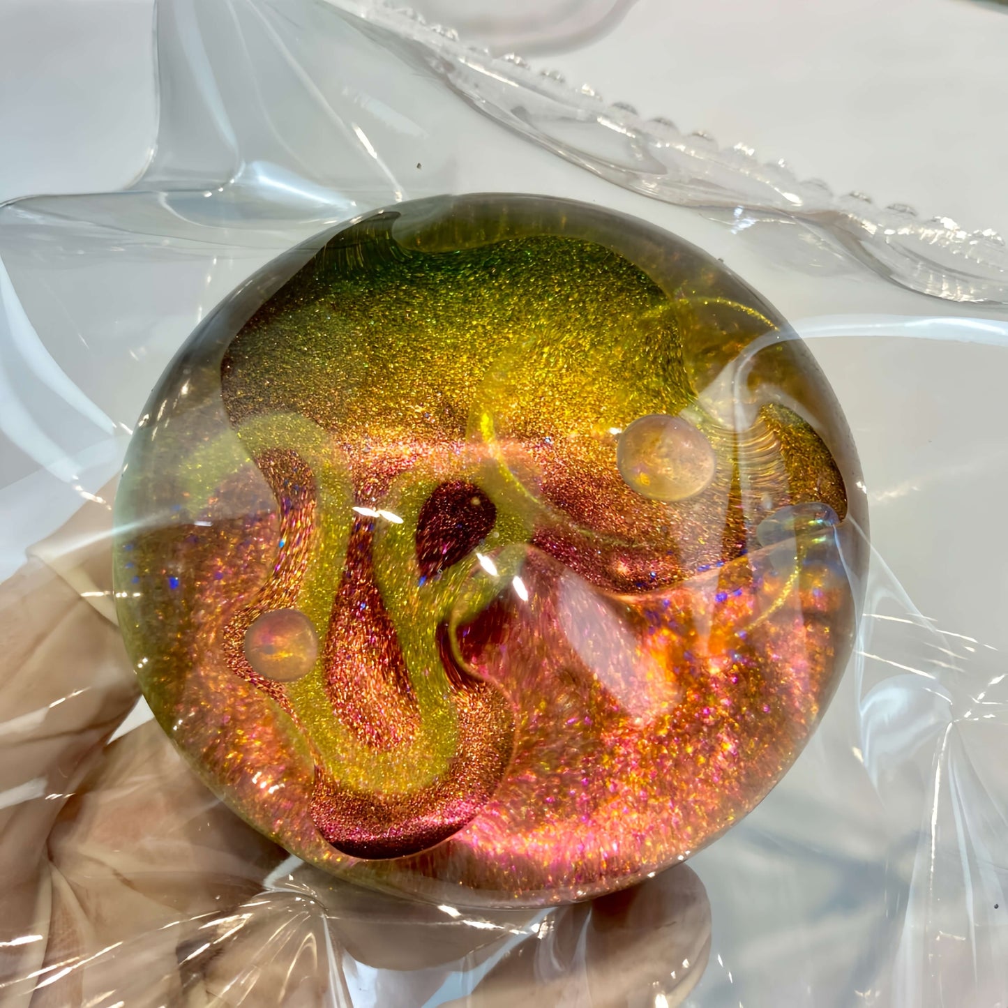 Clear silicone Leo galaxy orb with neon nebula design from lovesquishy