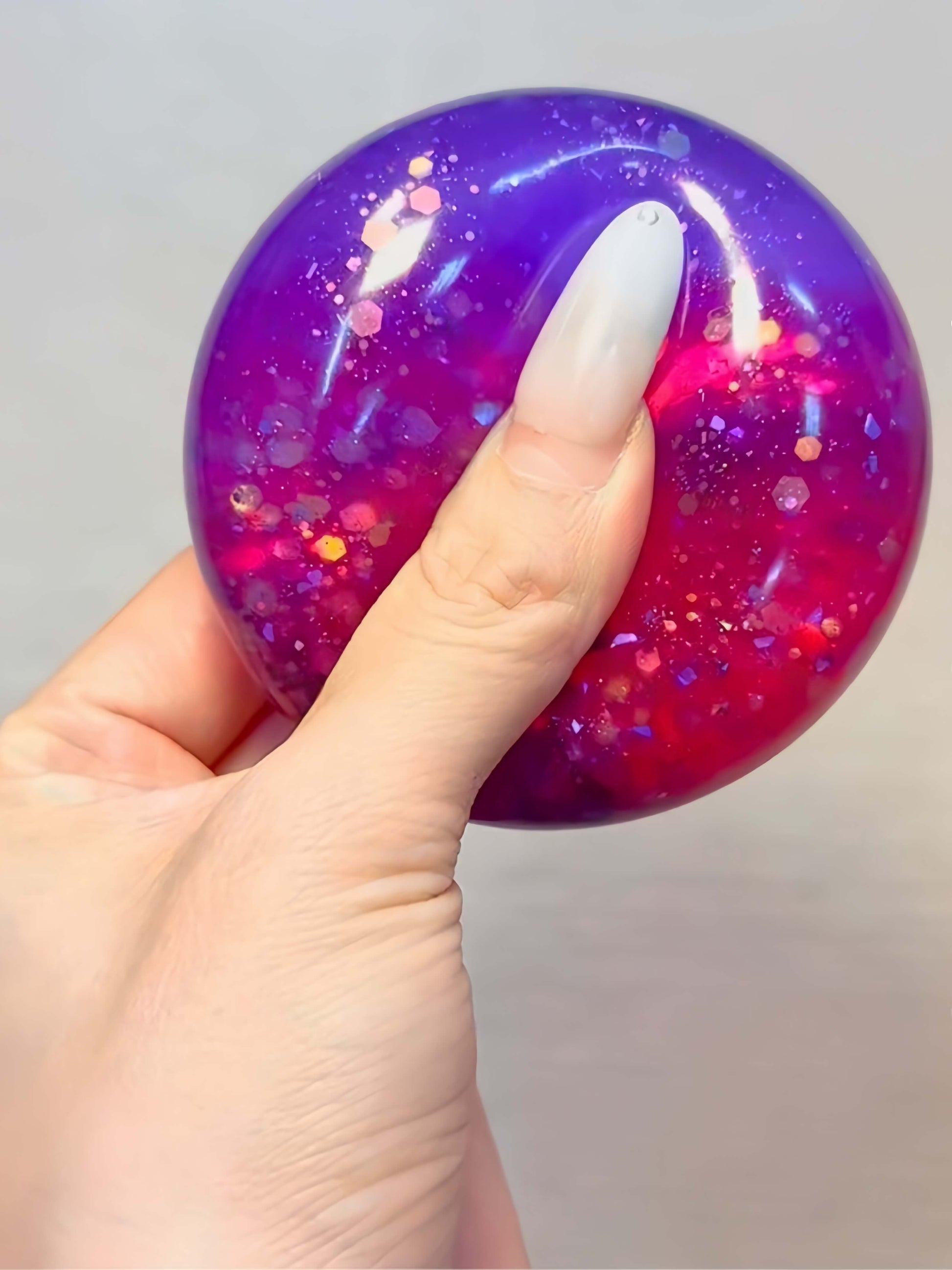 Purple and pink glitter dual-color flowing sand handmade stress relief ball - Magic Potion | Lovesquishy