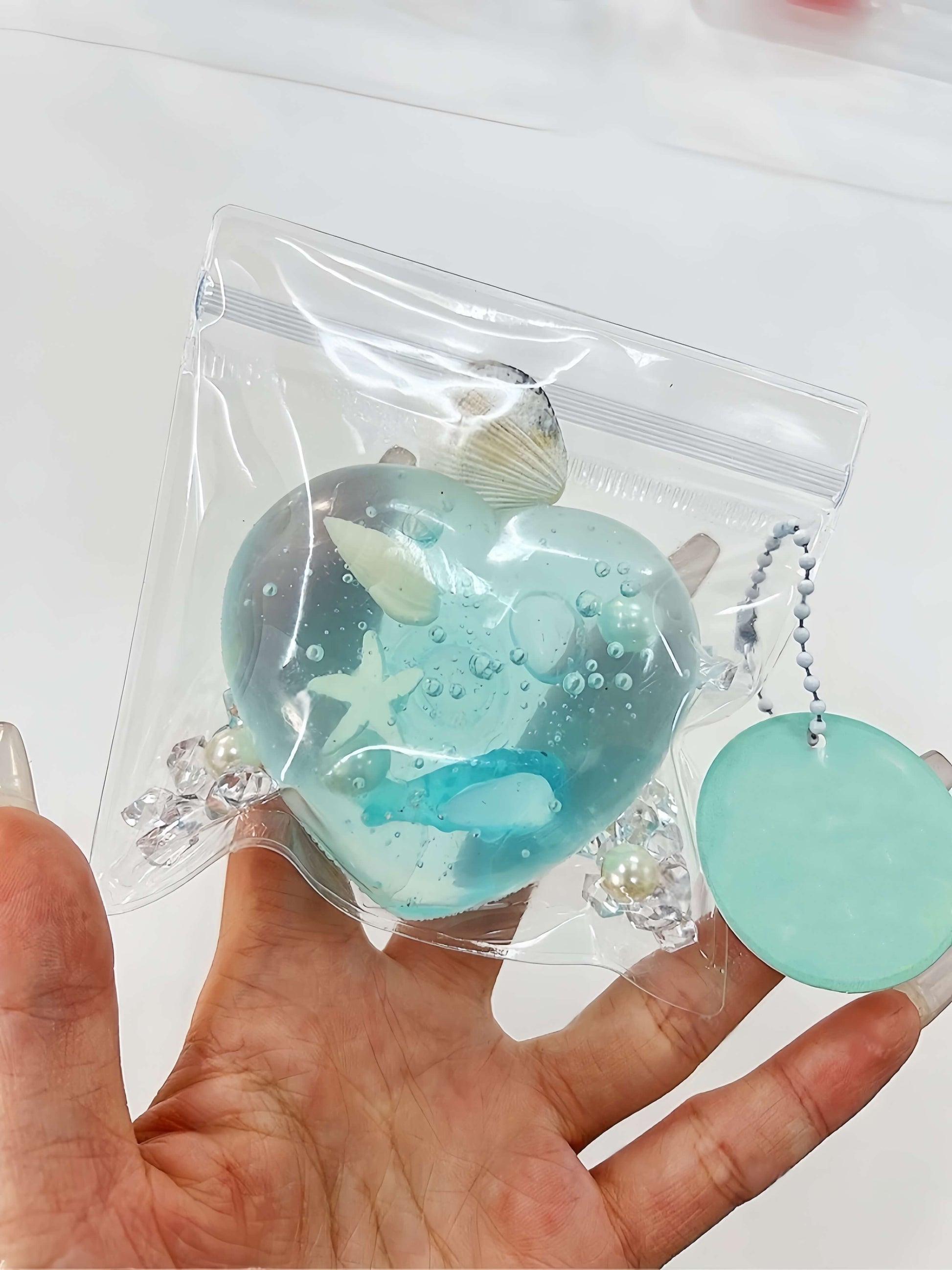 Blue heart-shaped handmade stress relief ball with ocean-themed decorations - Ocean Heart design