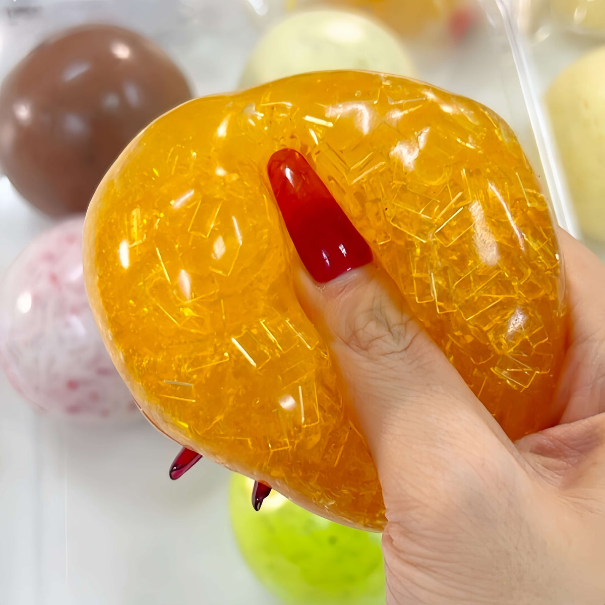Handmade ultra-soft orange hard candy jelly ice squishy toy, light compression stress relief ball for kids & adults