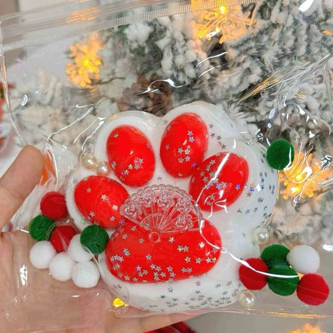 Red cat paw squishy toy with white bottom design