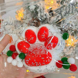 Red cat paw squishy toy with white bottom design