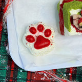 Red paw onigiri squishy with cherry details; soft holiday stress relief toy from lovesquishy