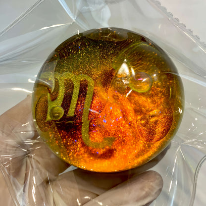 Clear silicone Scorpio galaxy orb with gilded nebula design from lovesquishy
