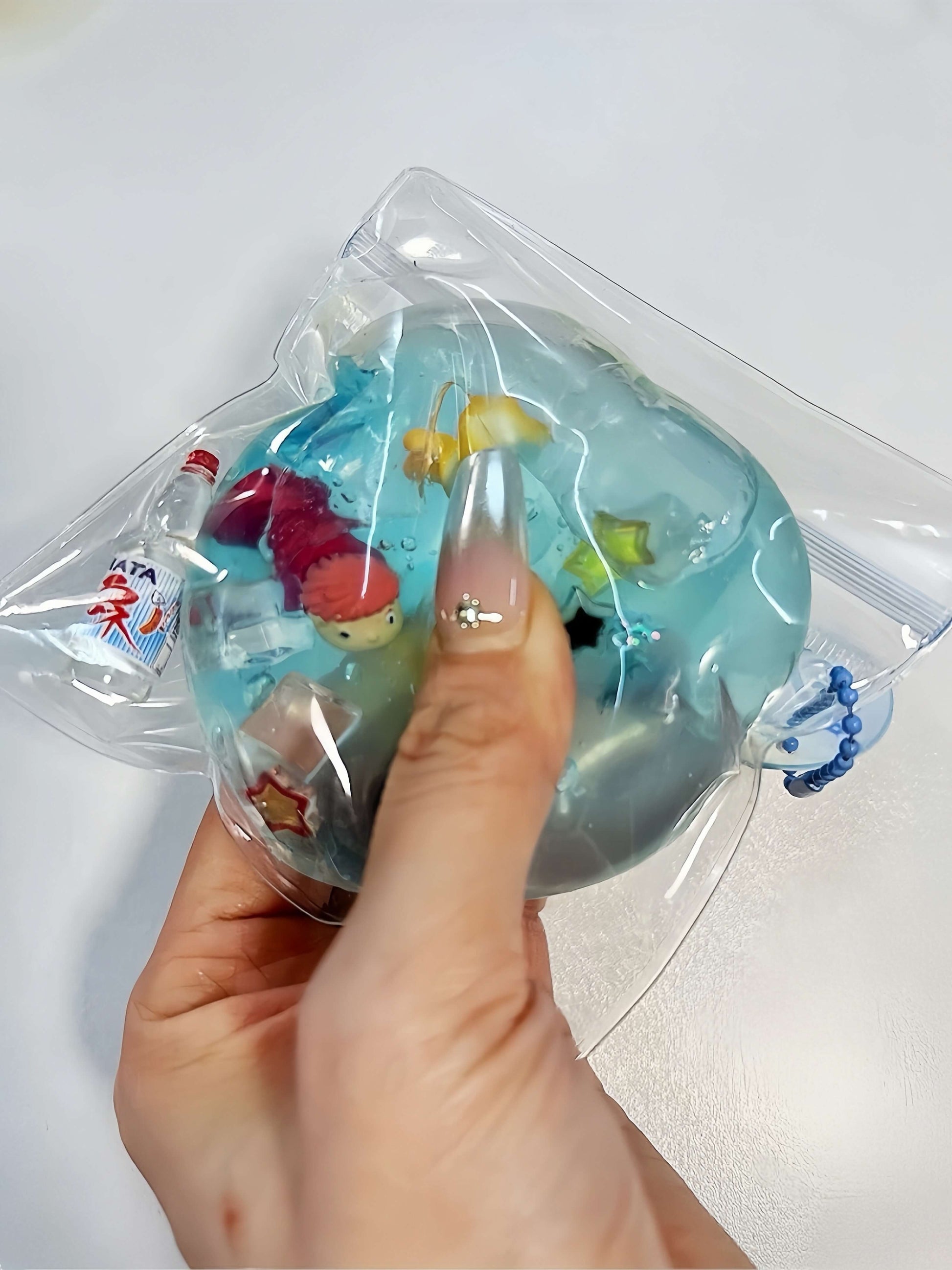 Heart-shaped handmade stress relief ball featuring underwater goldfish - Underwater Goldfish