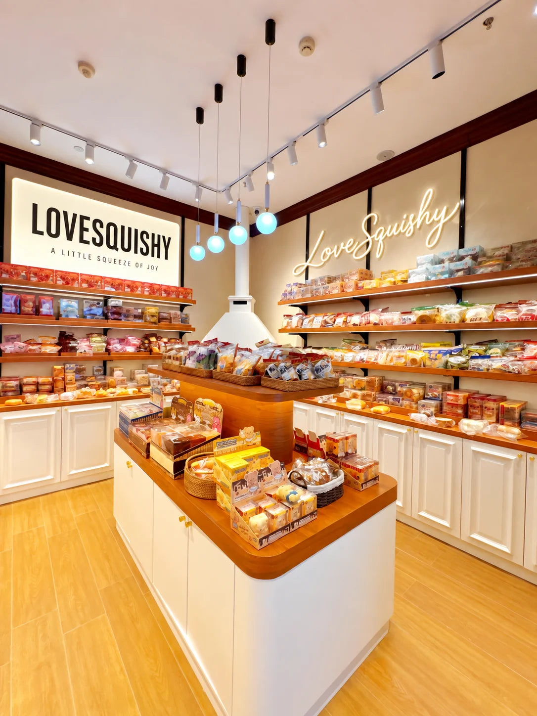 LoveSquishy branded shop scene with illuminated wall signage
